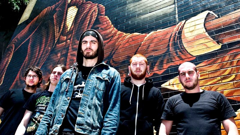 band in front of mural