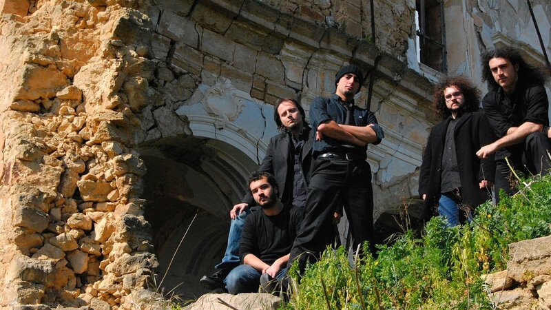 band in front of old ruins