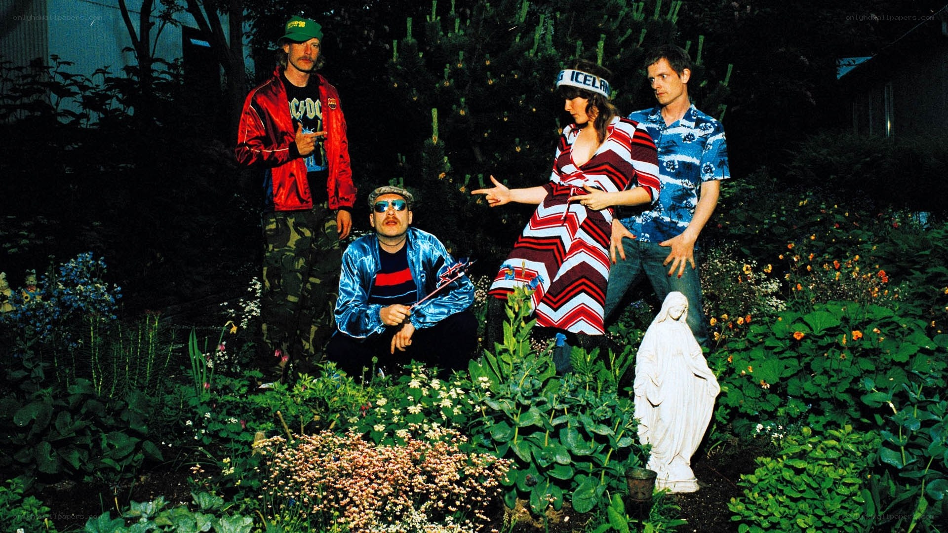 band in garden with statue