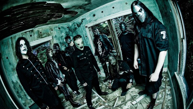 band in masks and dark clothing