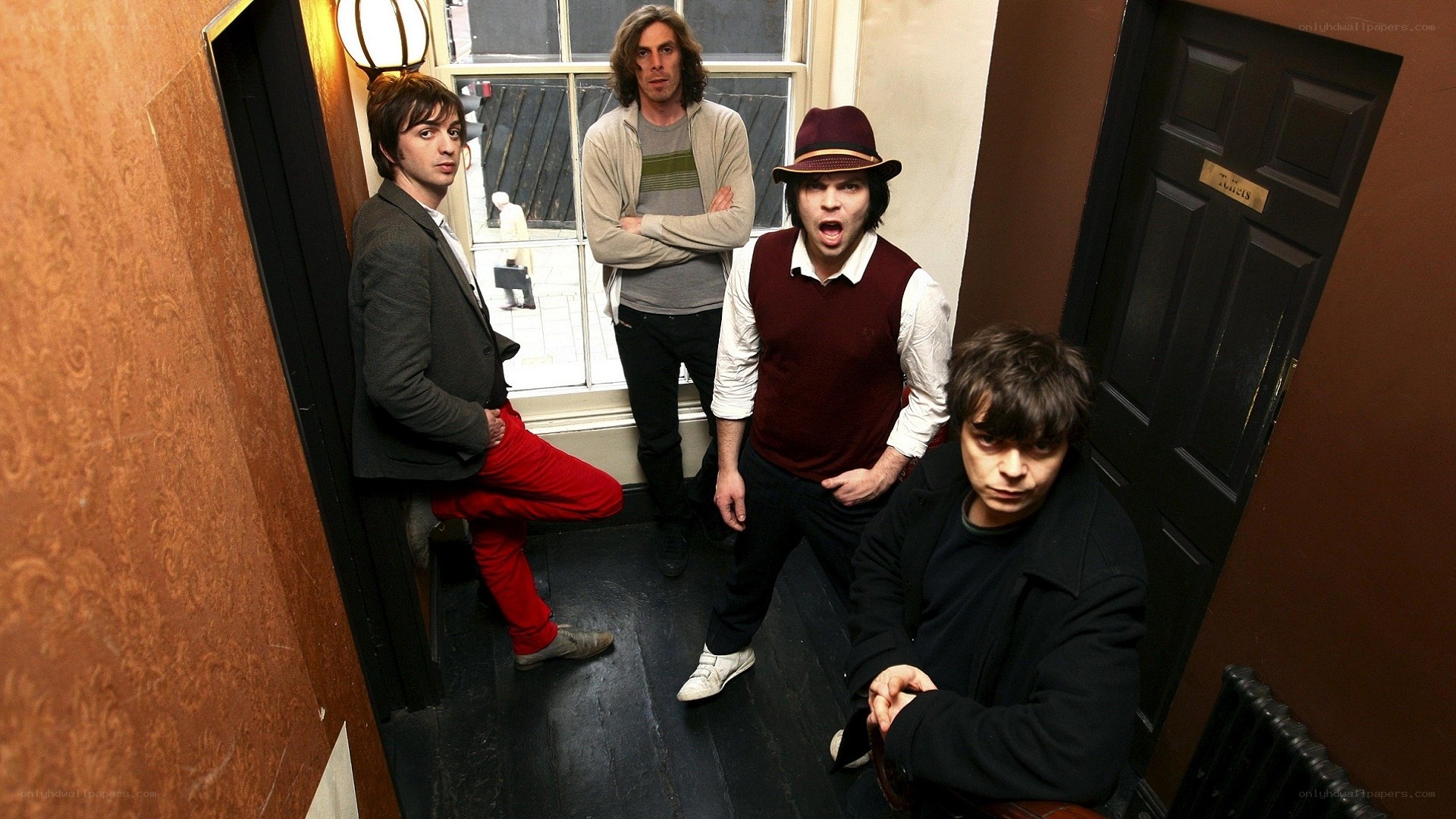 band in narrow hallway