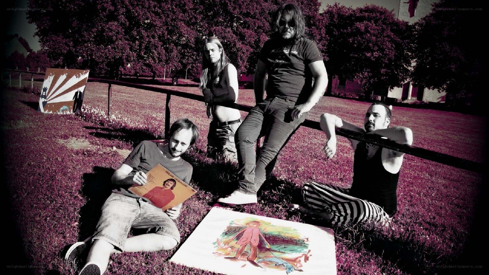 band in park with artwork