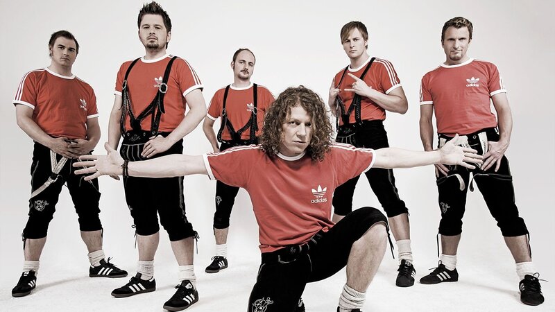 band in red shirts and lederhosen