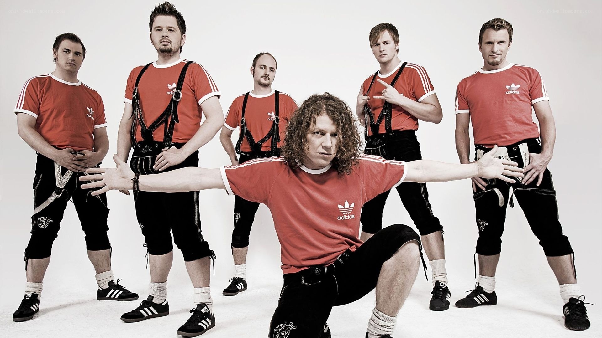 band in red shirts and lederhosen