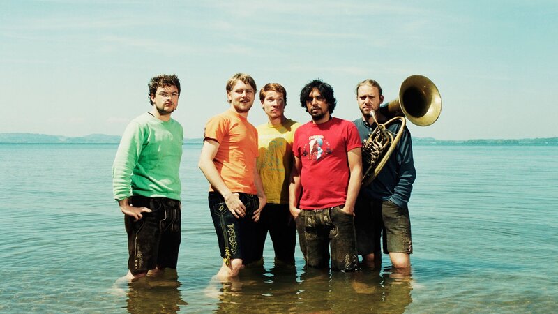 band in water with tuba