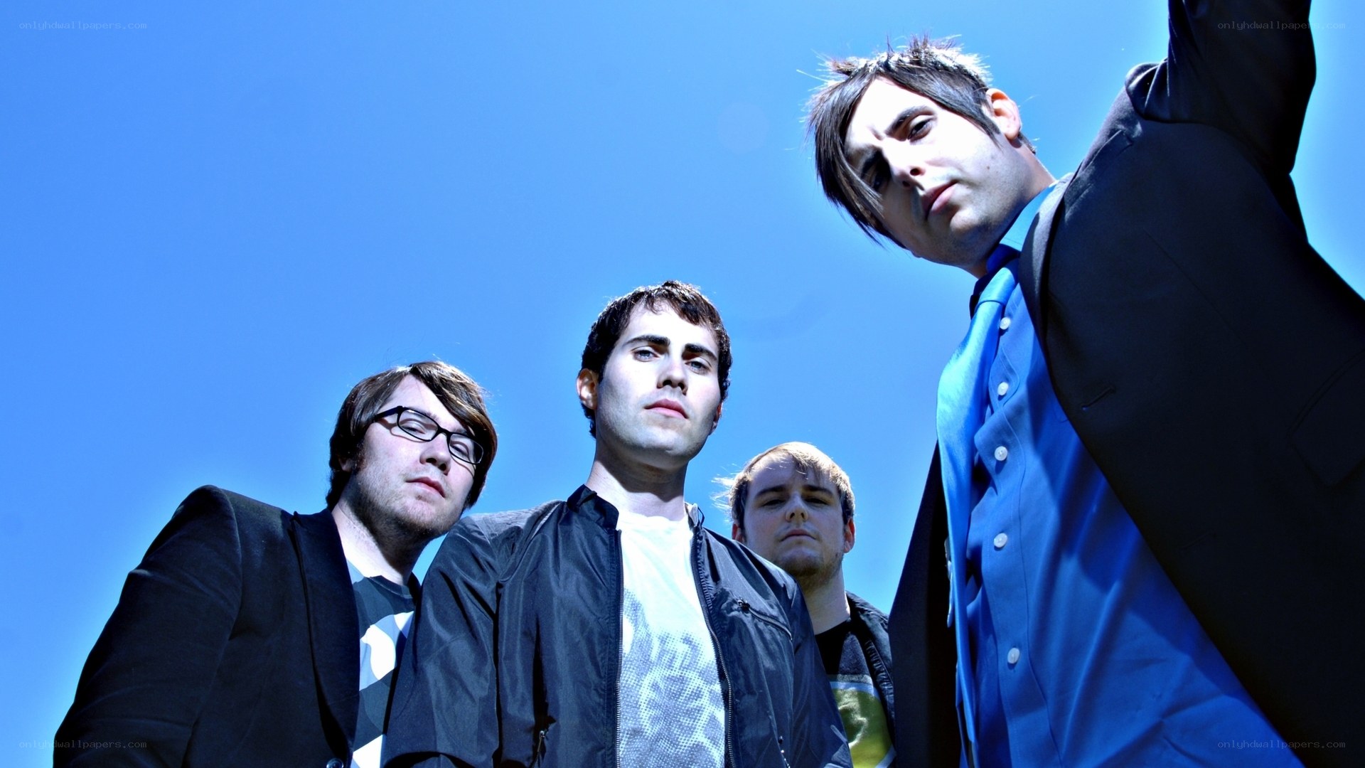 band members against blue sky