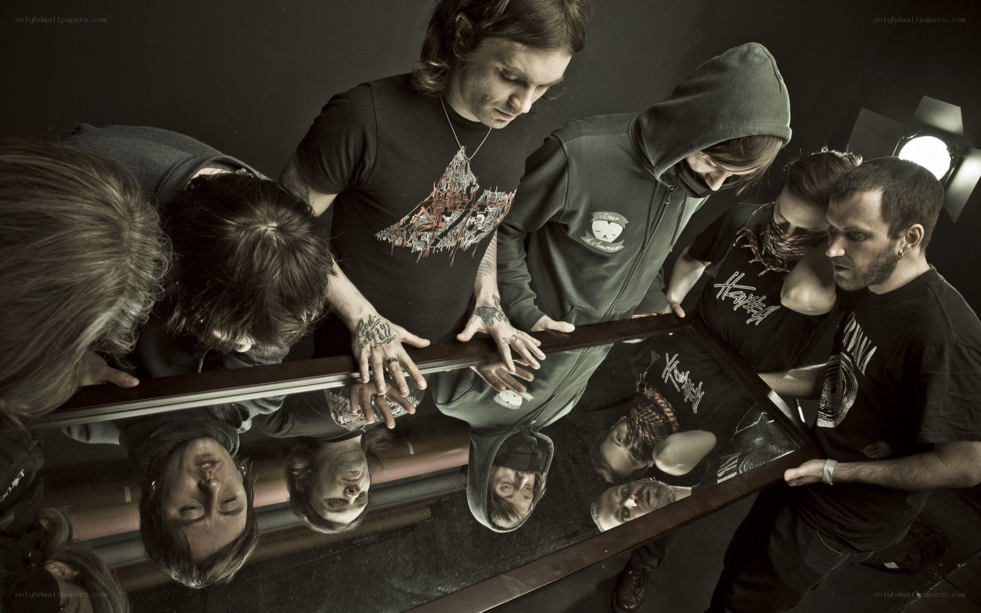 band members around mirror