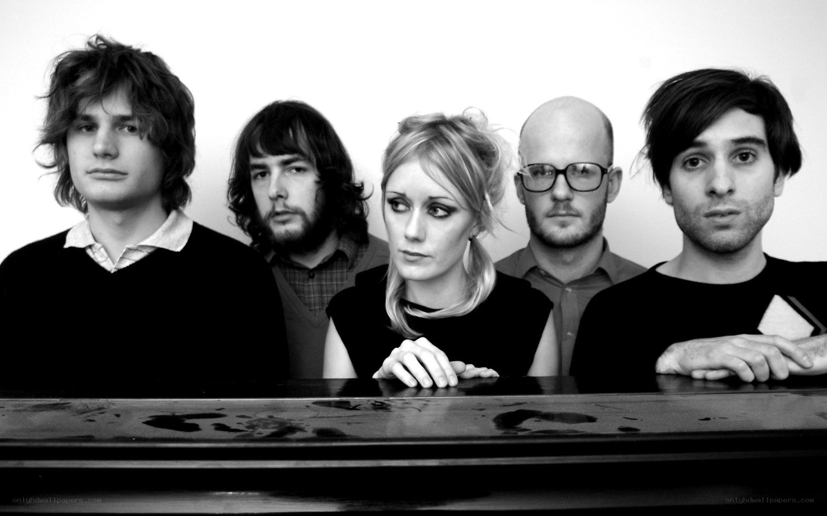 band members at a piano
