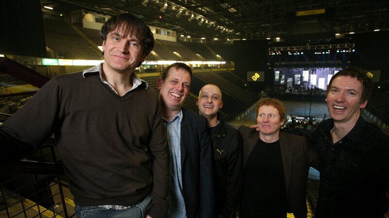 band members at concert venue