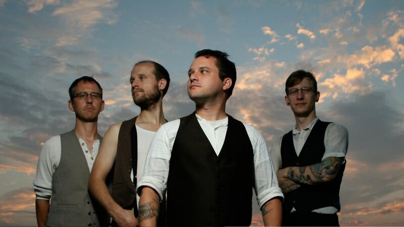 band members at sunset