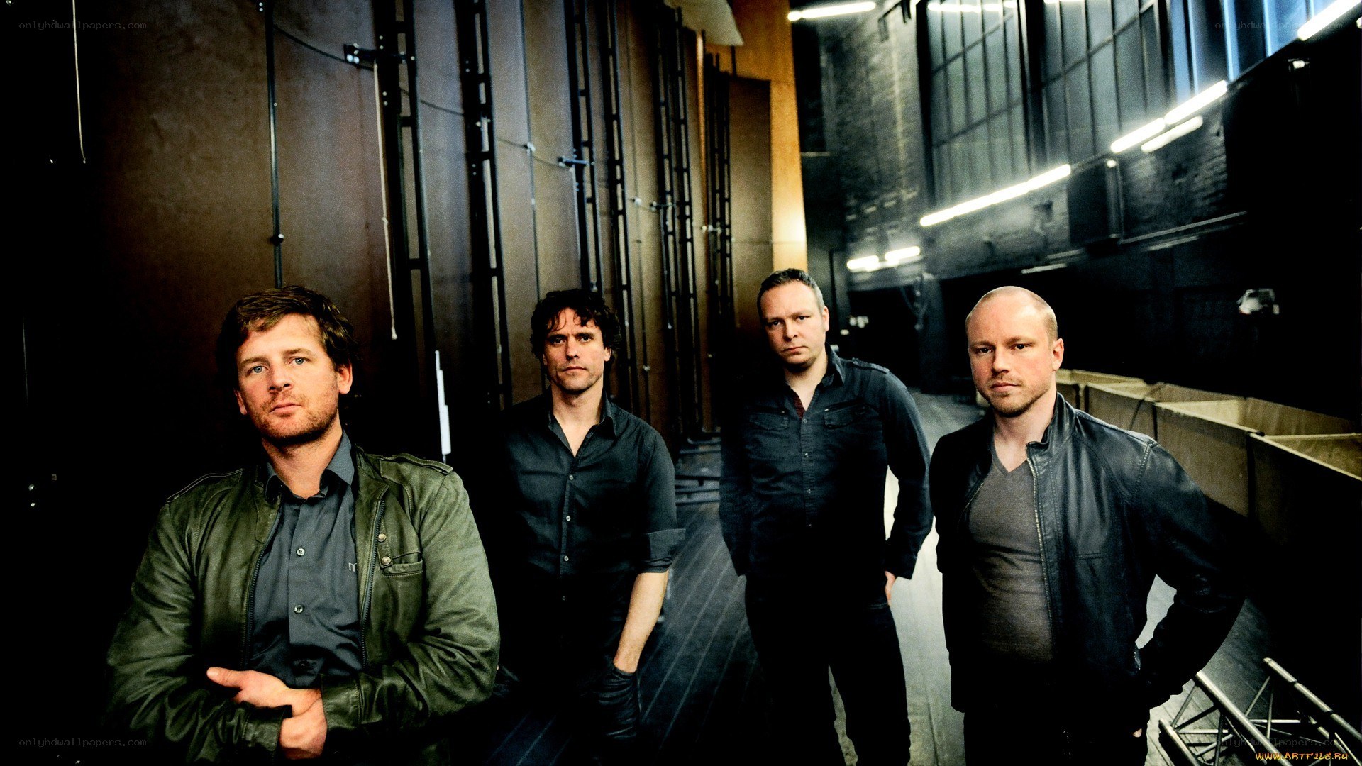band members in a backstage area