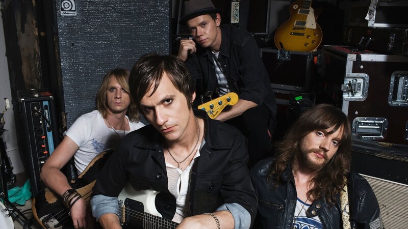 band members in a backstage setting