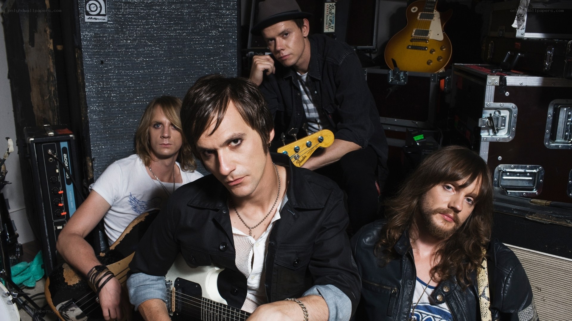 band members in a backstage setting