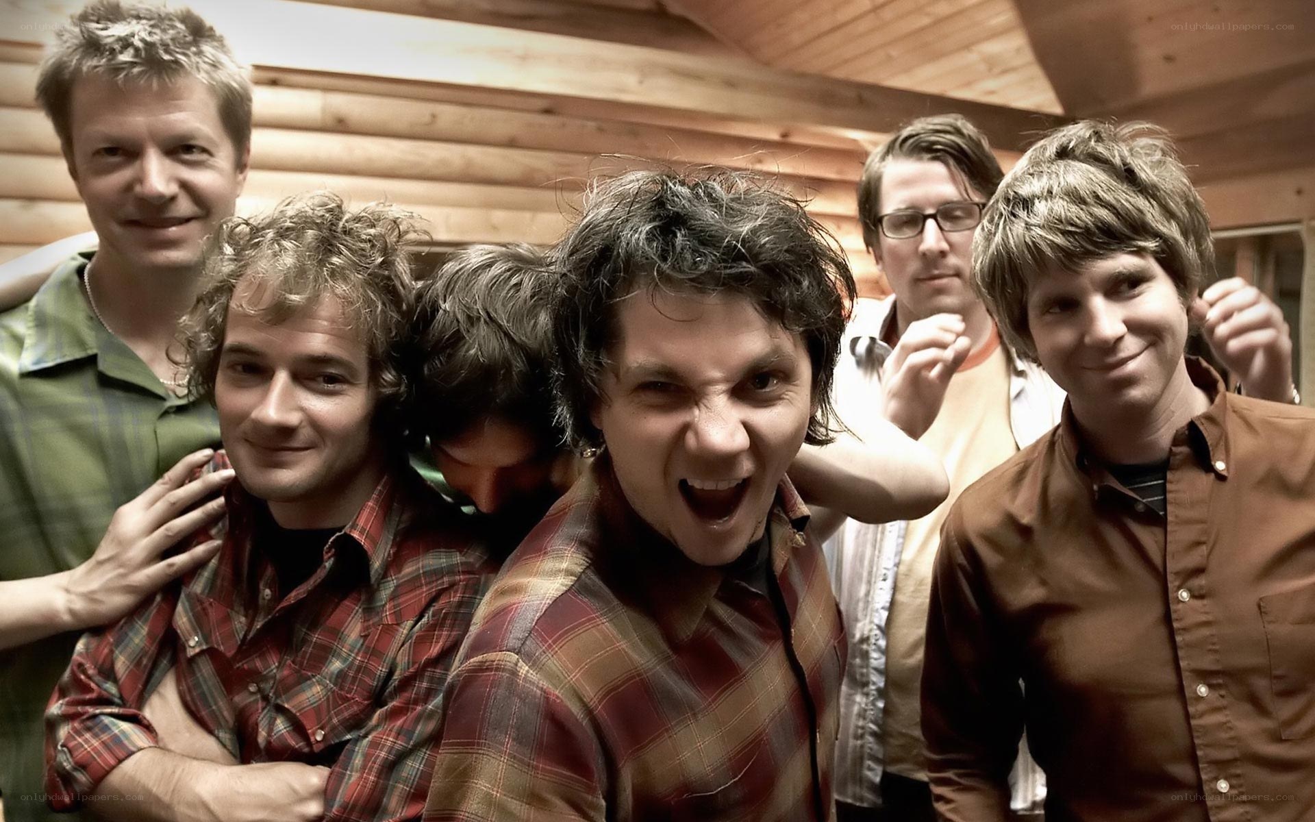 band members in a cabin