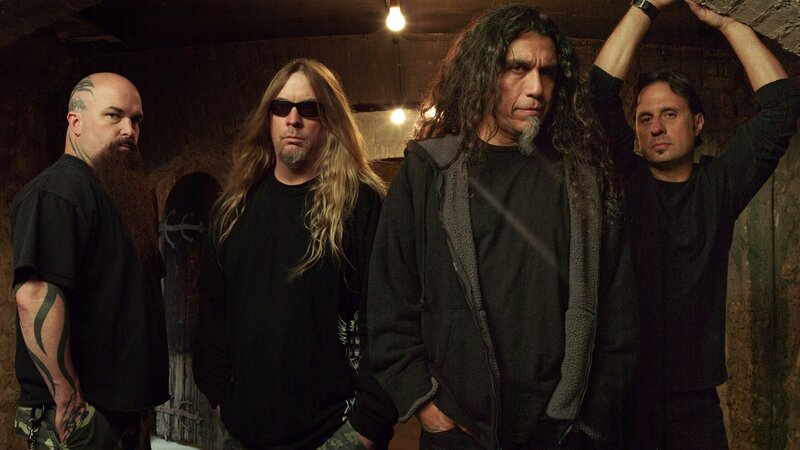 band members in a dimly lit room