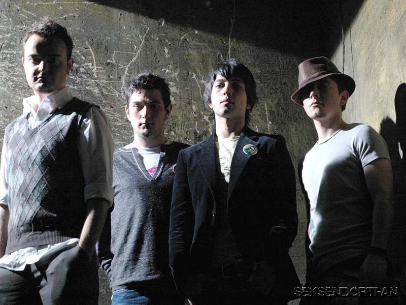 band members in a dimly lit room