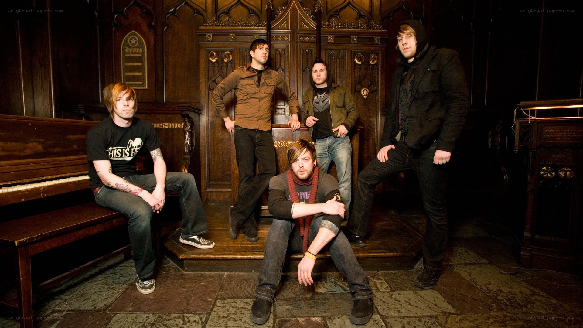 band members in a gothic room