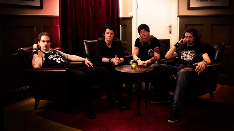 band members in a lounge