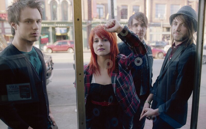 band members in a phone booth