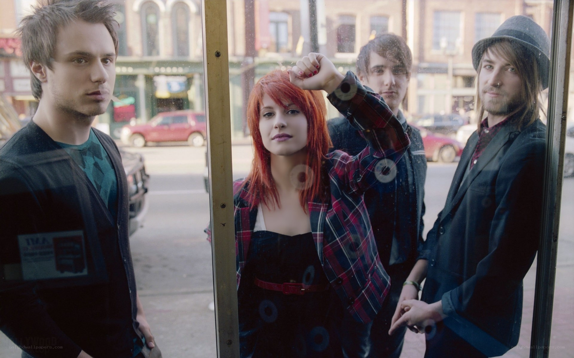 band members in a phone booth