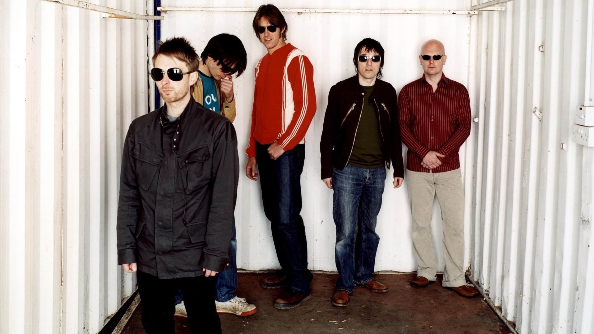 band members in a shipping container