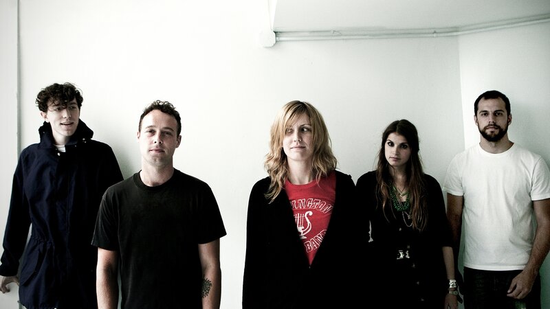band members in a white room