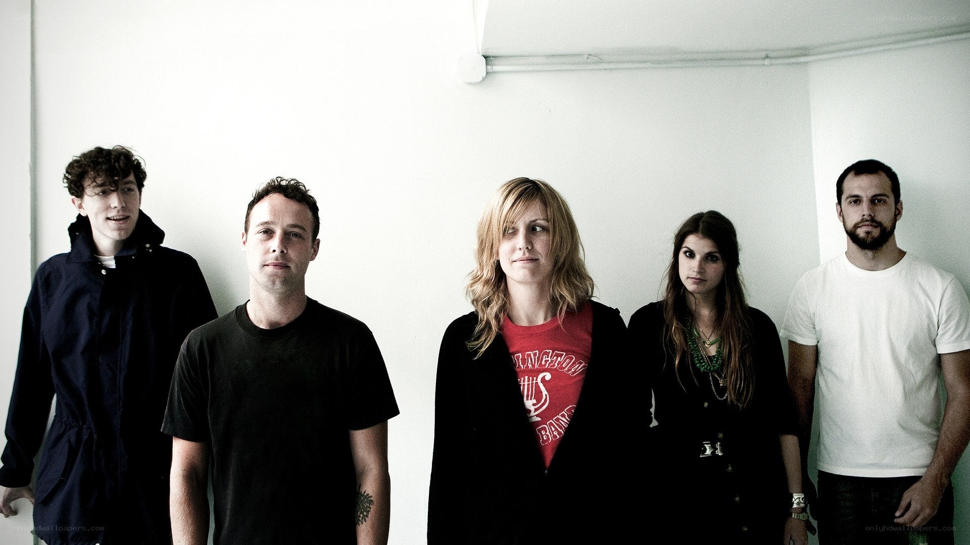 band members in a white room
