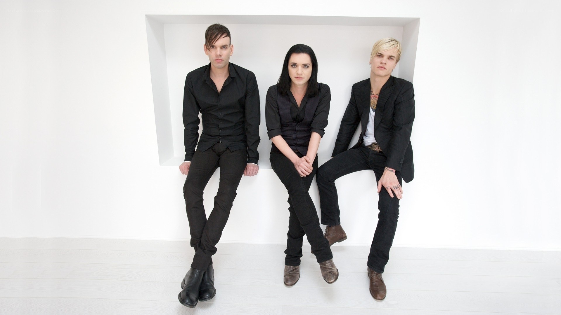 band members in black clothing