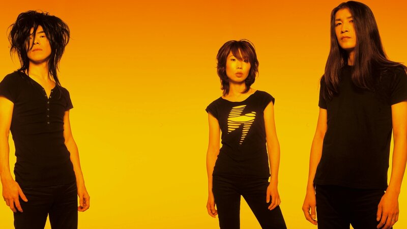 band members in black on yellow