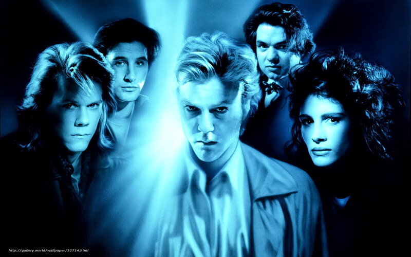 band members in blue light