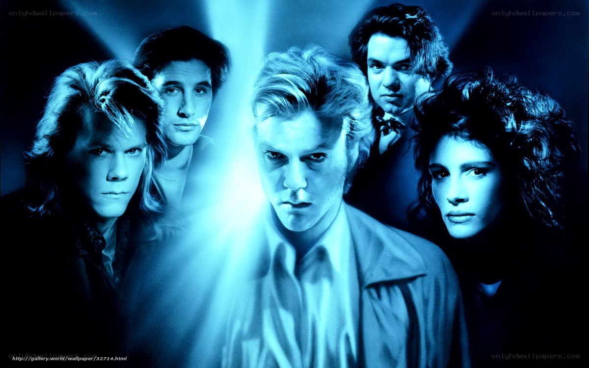 band members in blue light