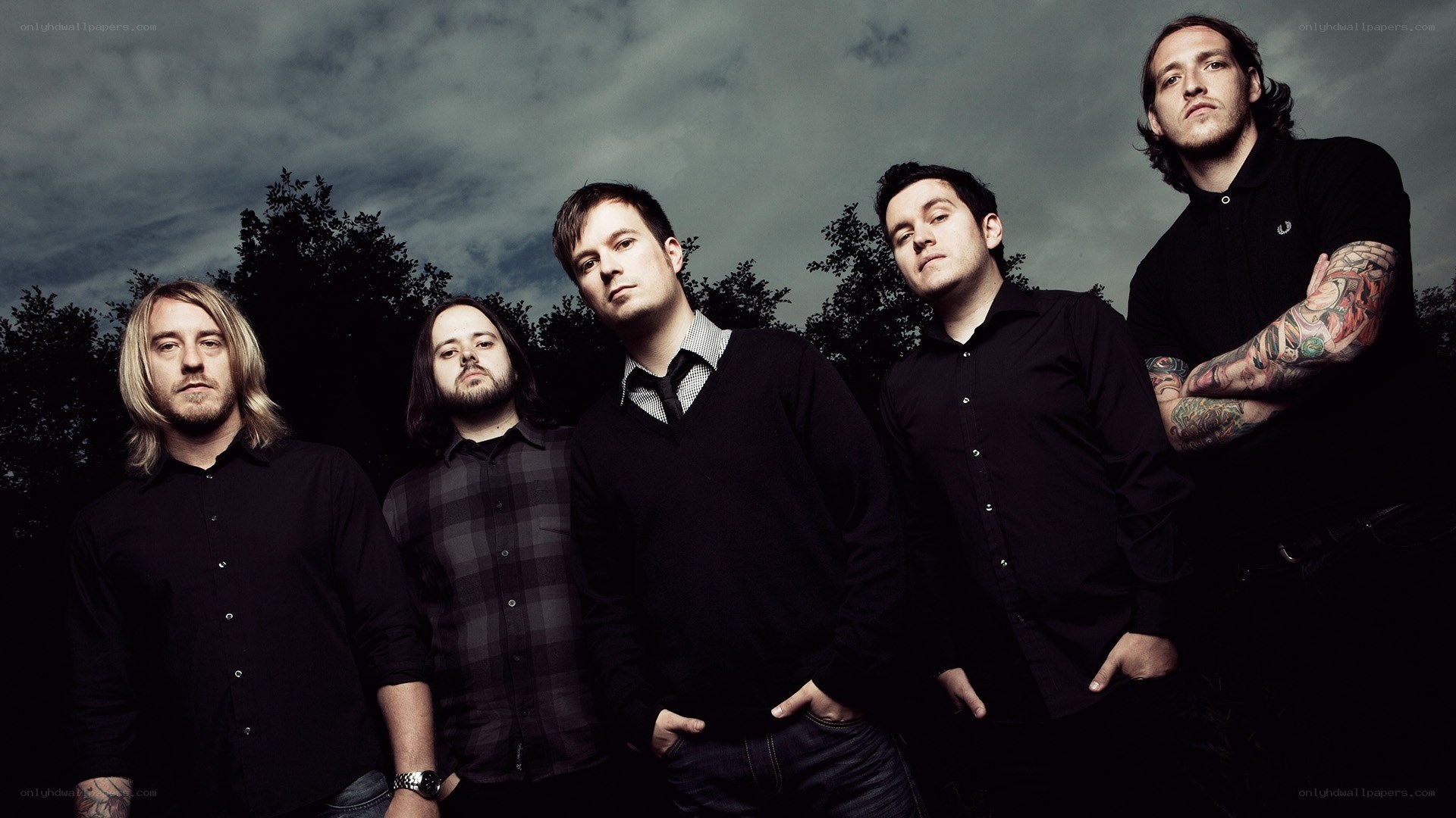 band members in dark clothing