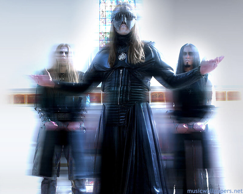 band members in dark costumes
