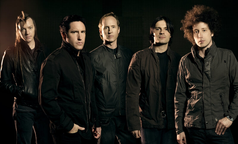 band members in dark jackets