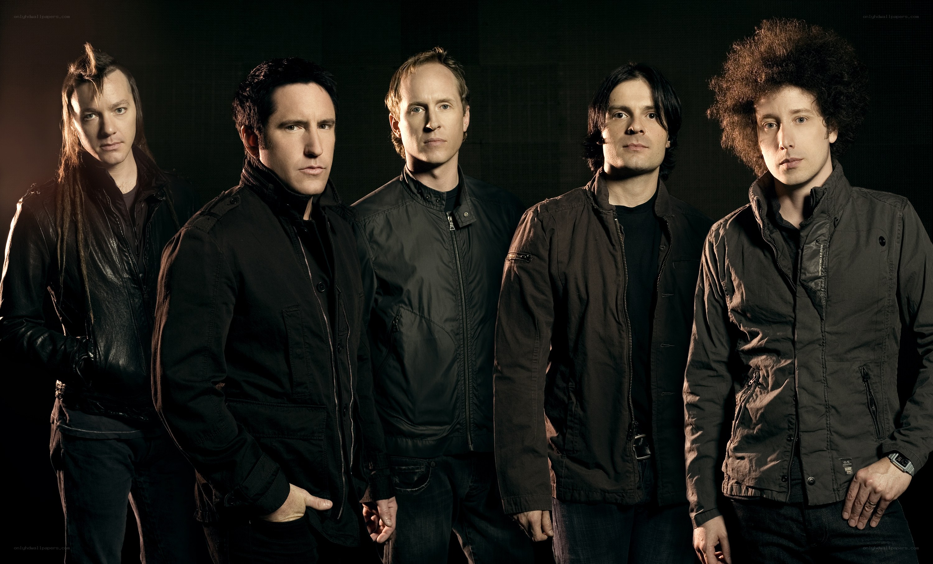 band members in dark jackets