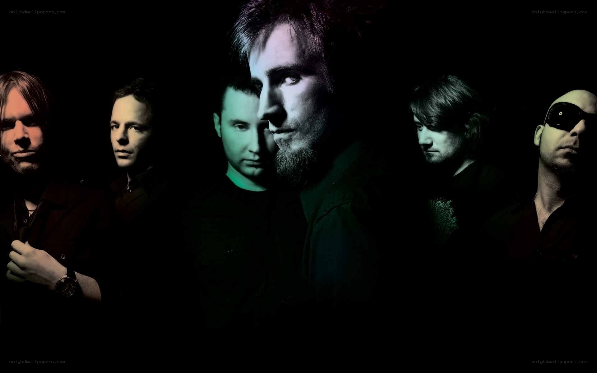 band members in dark lighting