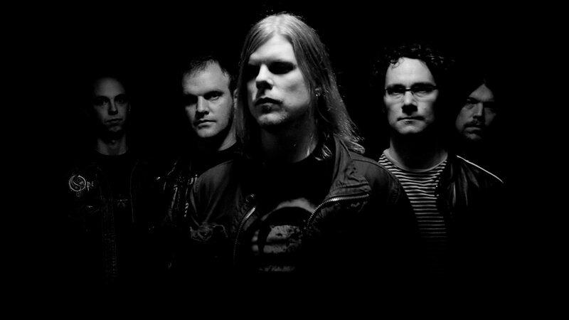 Band Members in Dark Room — Black, Serious