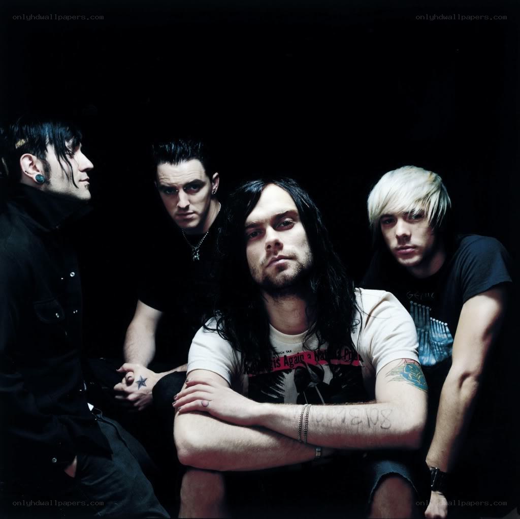 band members in dark setting