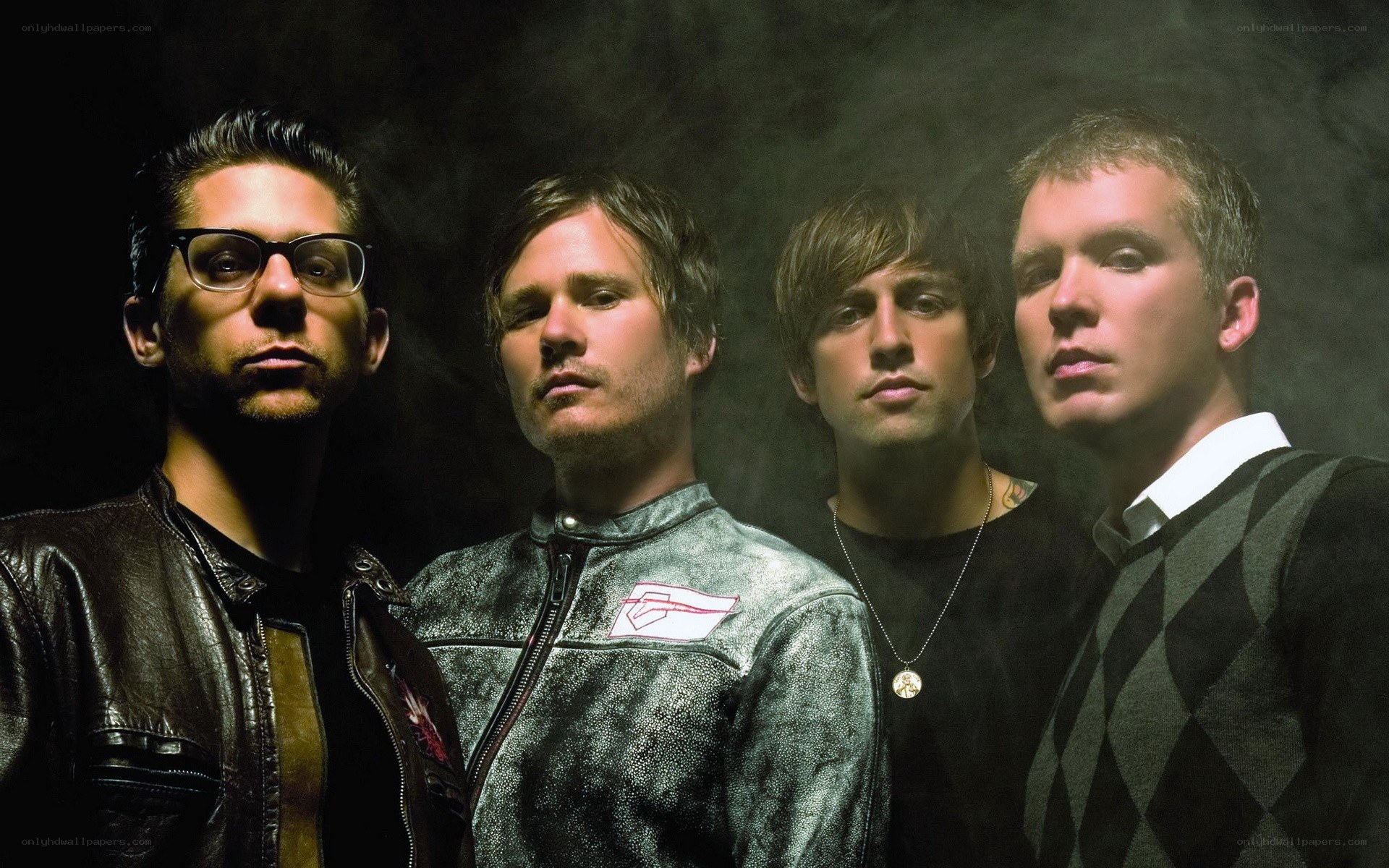 band members in dark setting