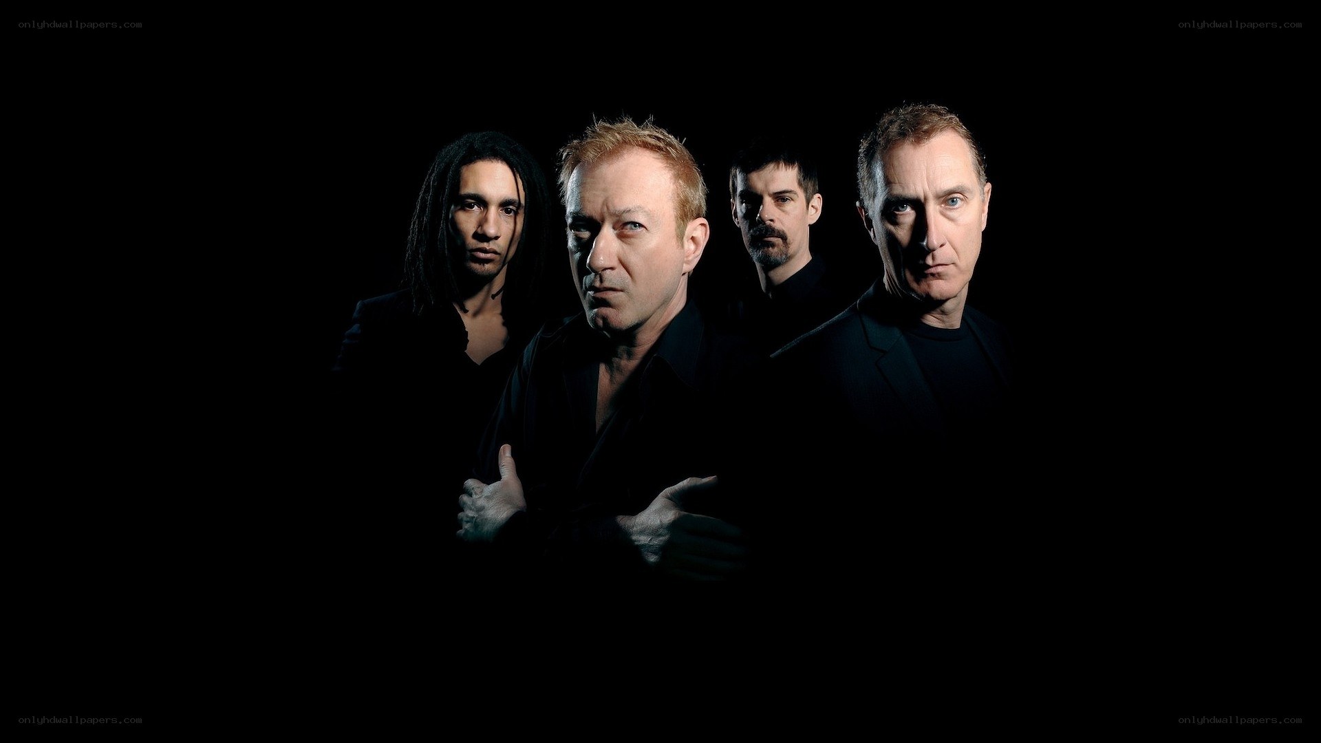 band members in dark setting