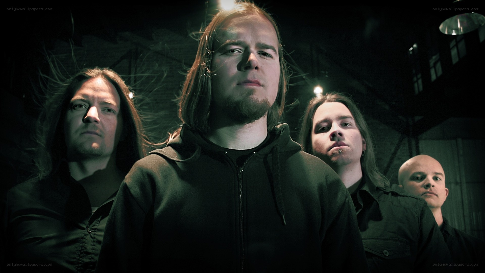 band members in dark setting