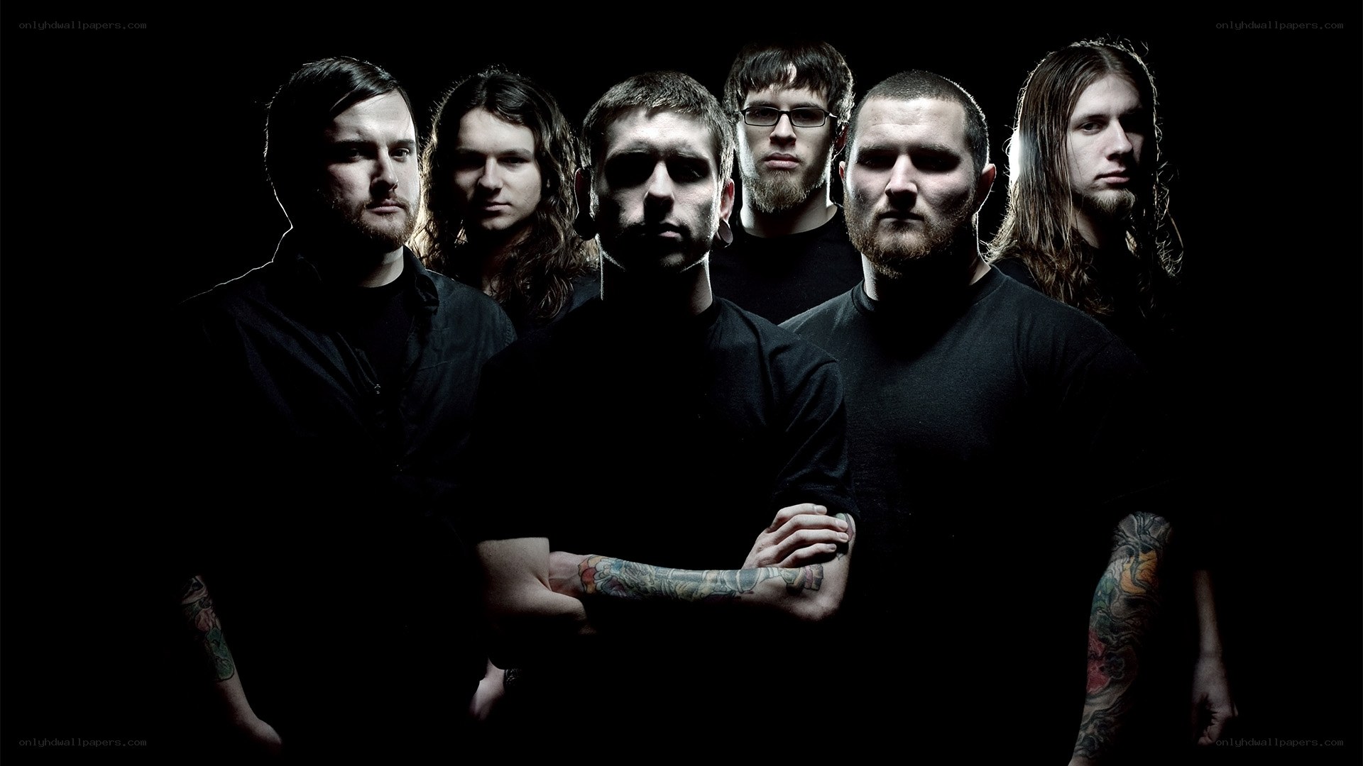 band members in dark setting