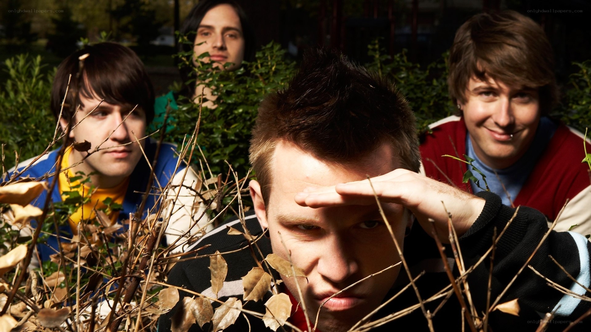 band members in foliage