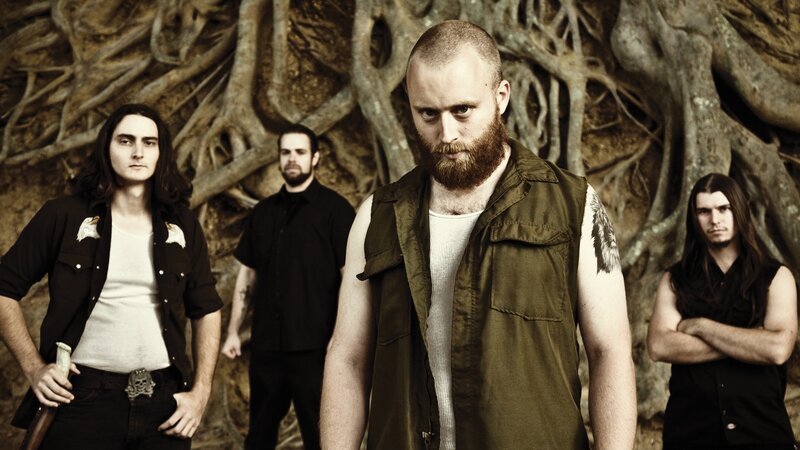 Band Members in Forest — Brown, Serious