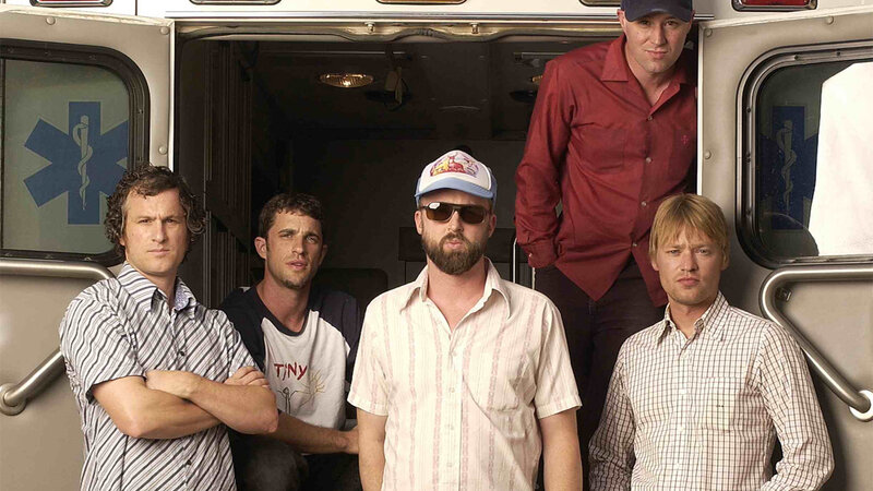 band members in front of ambulance