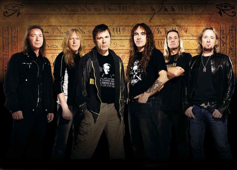 band members in front of hieroglyphs