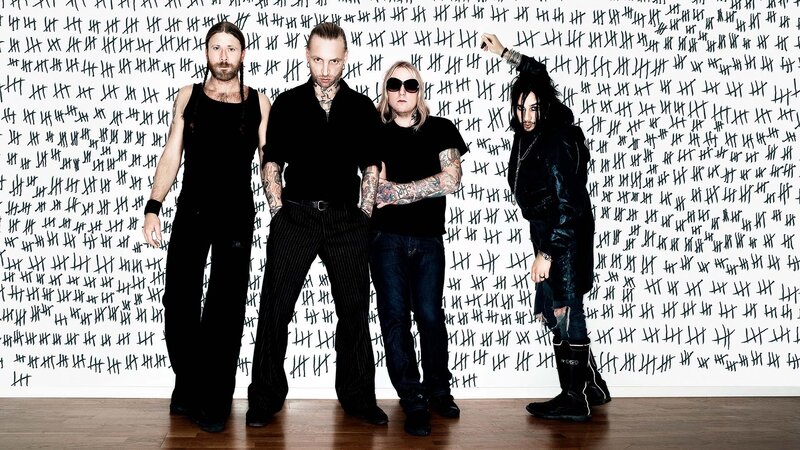 band members in front of tally marks