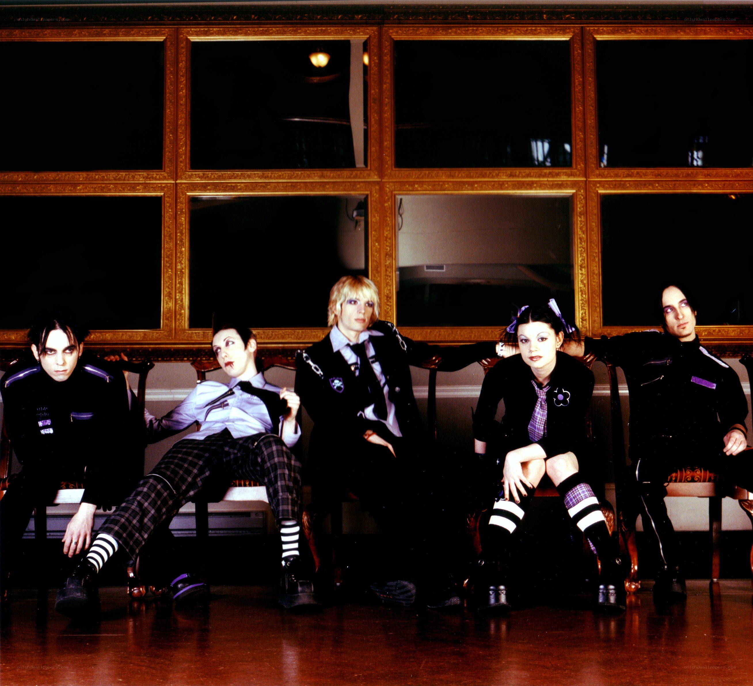 band members in goth attire
