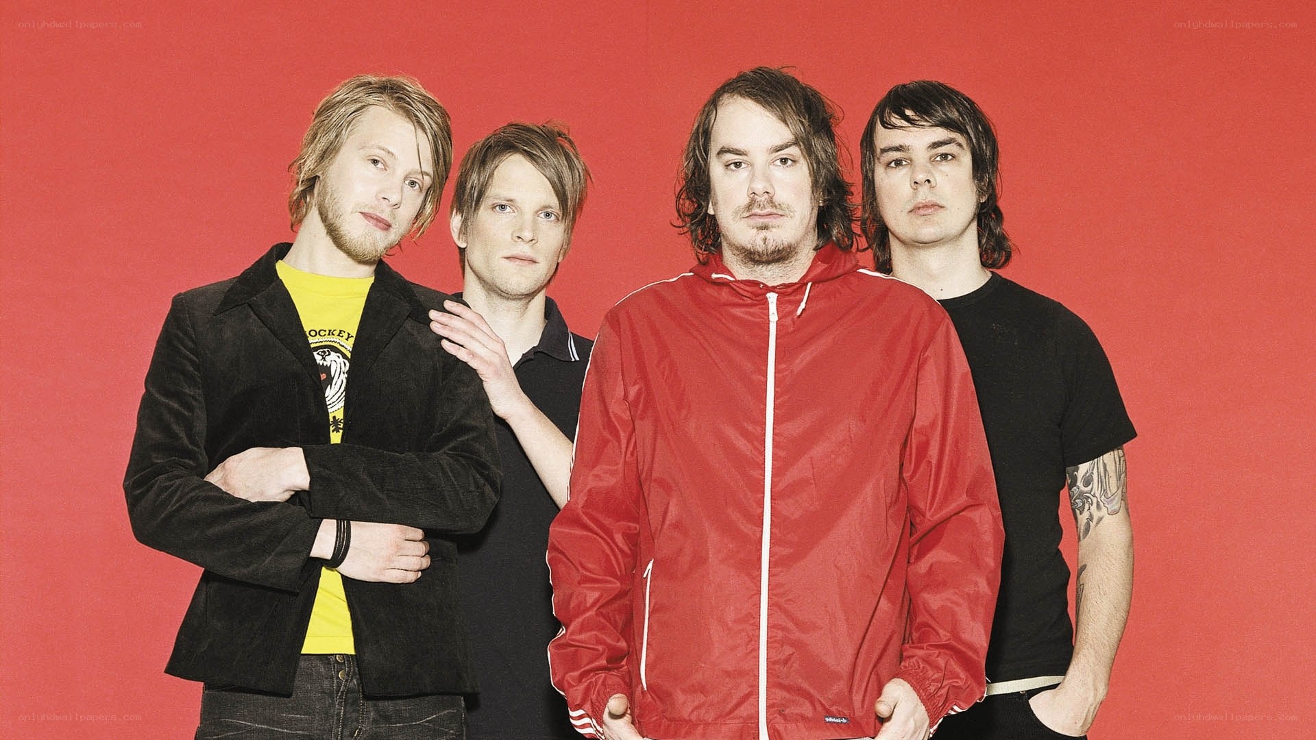 band members in red jacket