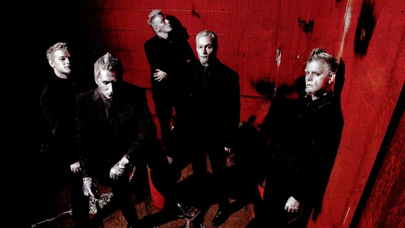 band members in red room